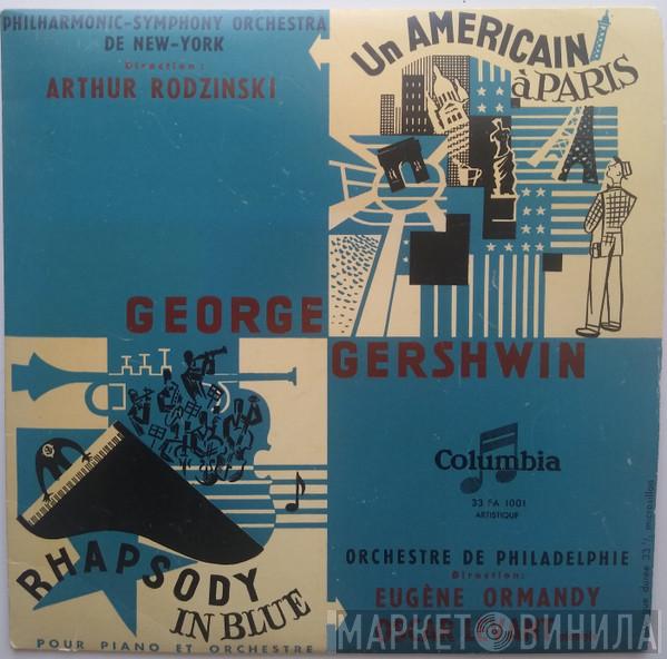 - George Gershwin , Direction : The New York Philharmonic Orchestra , Artur Rodzinski , Direction : The Philadelphia Orchestra , Pianiste Eugene Ormandy  Oscar Levant  - Un Americain À Paris / Rhapsody In Blue