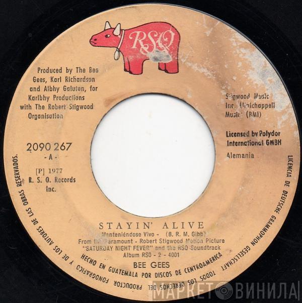 Bee Gees  - Stayin' Alive = Manteniéndose Vivo