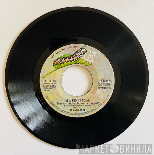  Eagles  - New Kid In Town = Nuevo Muchacho En La Ciudad / Victim Of Love = Victima Del Amor