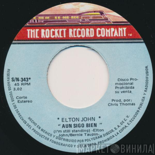  Elton John  - Aun Sigo Bien