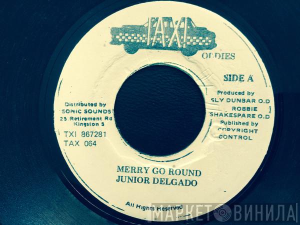  Junior Delgado  - Merry Go Round
