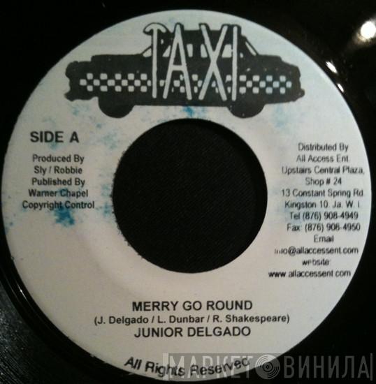 Junior Delgado  - Merry Go Round