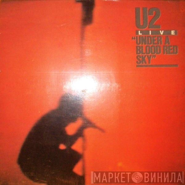  U2  - Live / Under A Blood Red Sky = En Vivo / Bajo Un Cielo Rojo Sangre