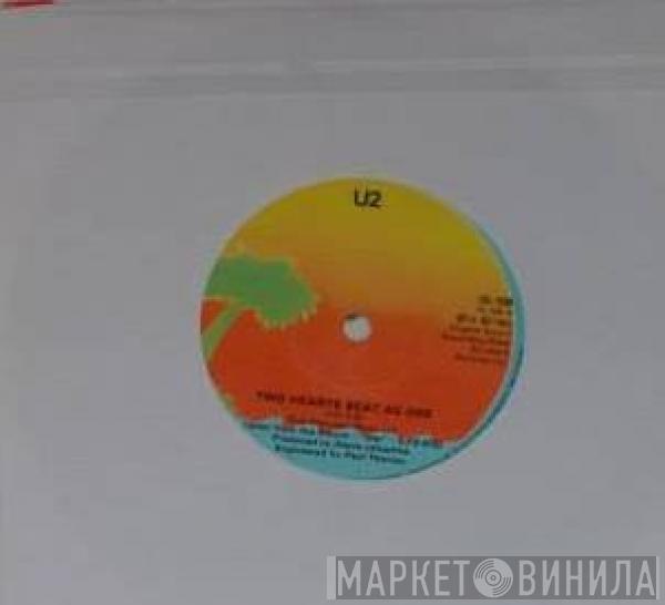  U2  - Two Hearts Beat As One